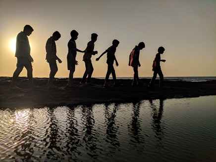 group-of-children-walking-near-body-of-water-silhouette-939700.jpg